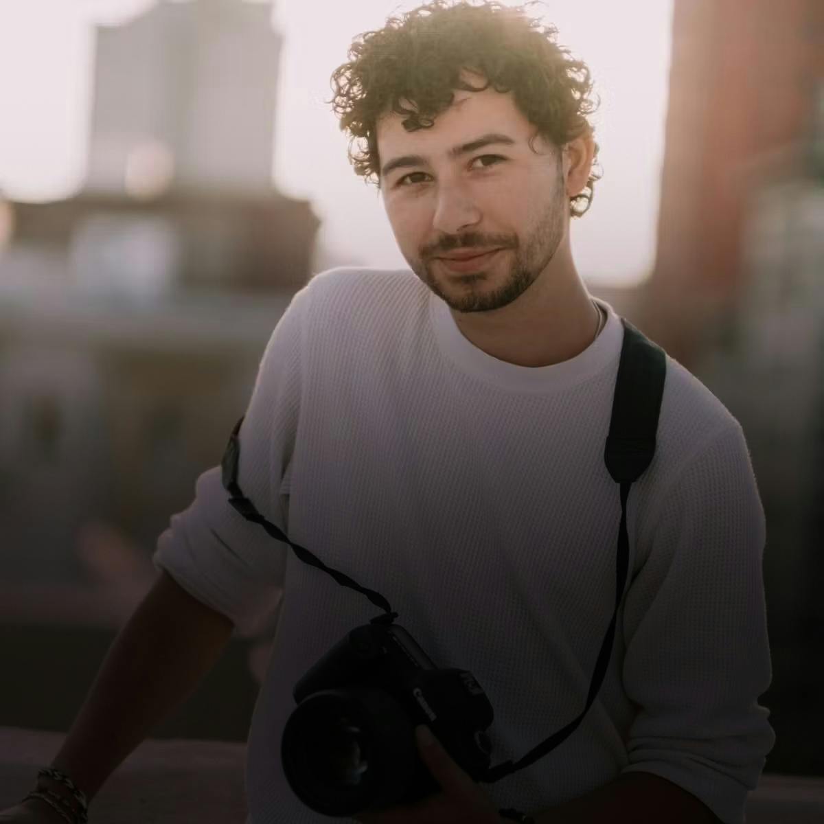 Man holding camera facing forward