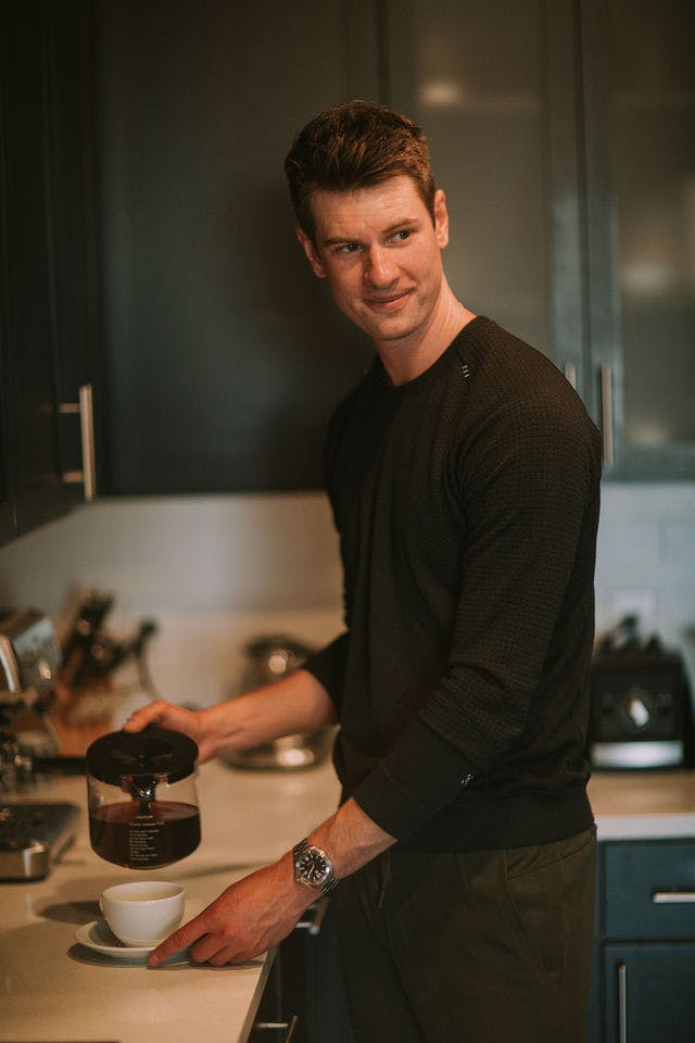 Dating profile photo with coffee, taken by The Match Artist