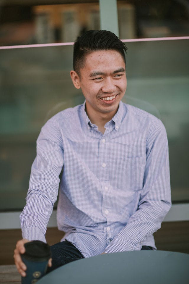 Dating profile photo with coffee, taken by The Match Artist