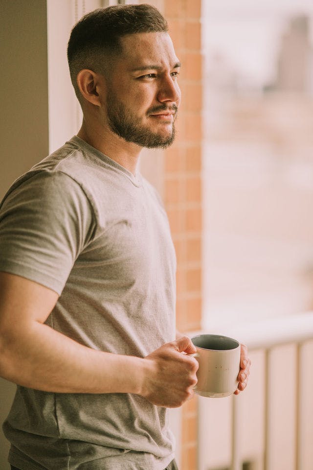 Dating profile photo with coffee, taken by The Match Artist