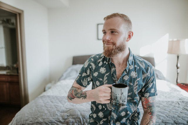 Dating profile photo with coffee, taken by The Match Artist