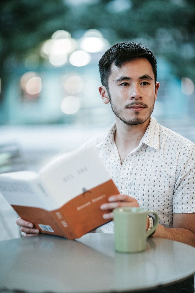 Dating profile photo with coffee, taken by The Match Artist