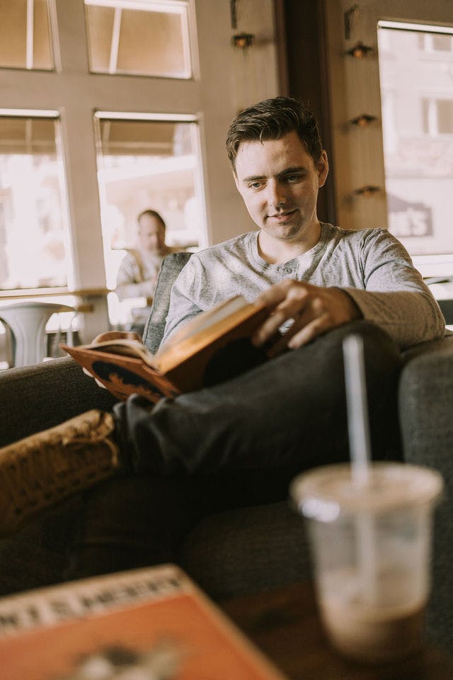 Dating profile photo with coffee, taken by The Match Artist