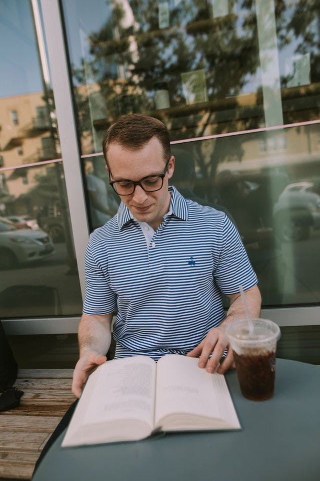 Dating profile photo with coffee, taken by The Match Artist