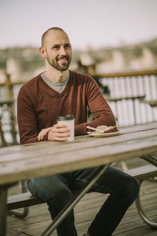 Dating profile photo with coffee, taken by The Match Artist