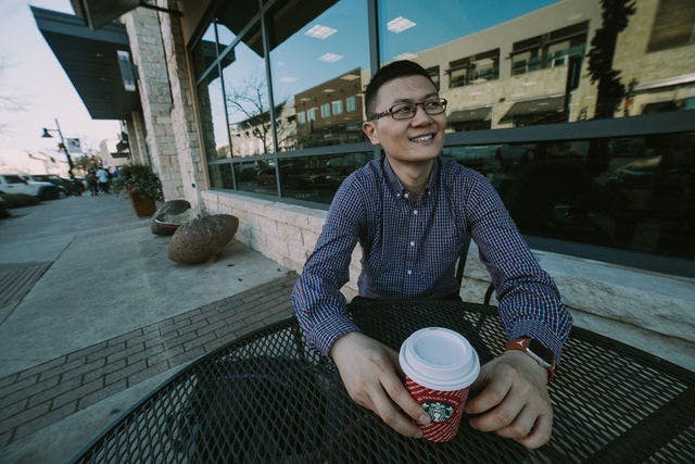 Dating profile photo with coffee, taken by The Match Artist