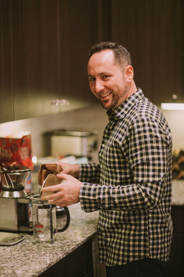 Dating profile photo with coffee, taken by The Match Artist