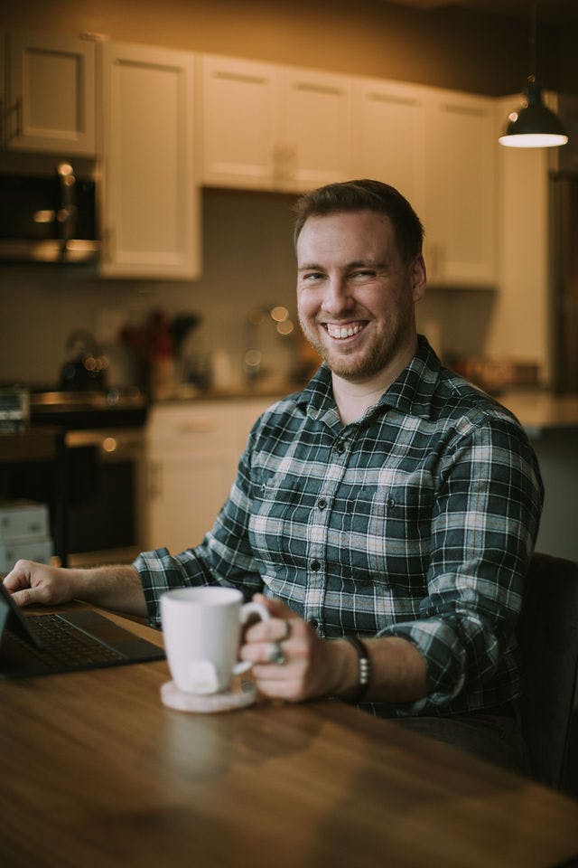 Dating profile photo with coffee, taken by The Match Artist