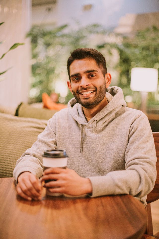 Dating profile photo with coffee, taken by The Match Artist