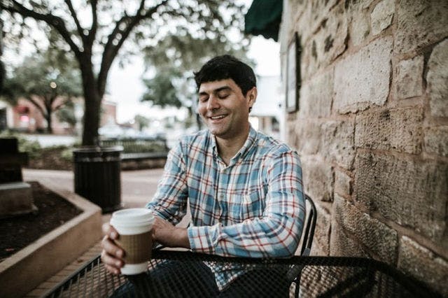 Dating profile photo with coffee, taken by The Match Artist