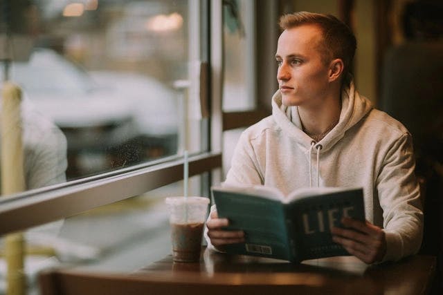 Dating profile photo with coffee, taken by The Match Artist