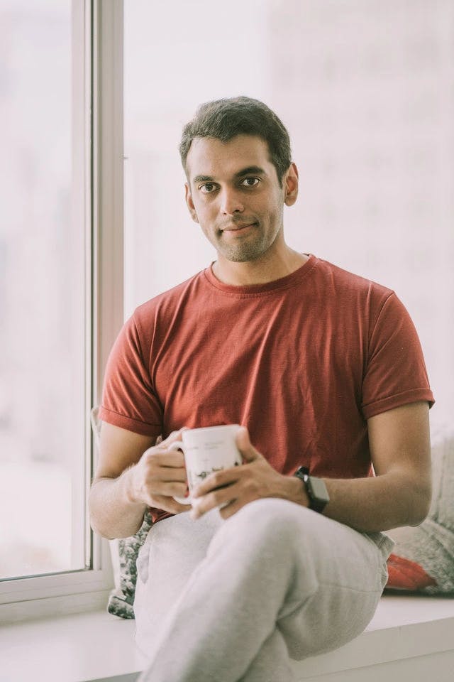 Dating profile photo with coffee, taken by The Match Artist