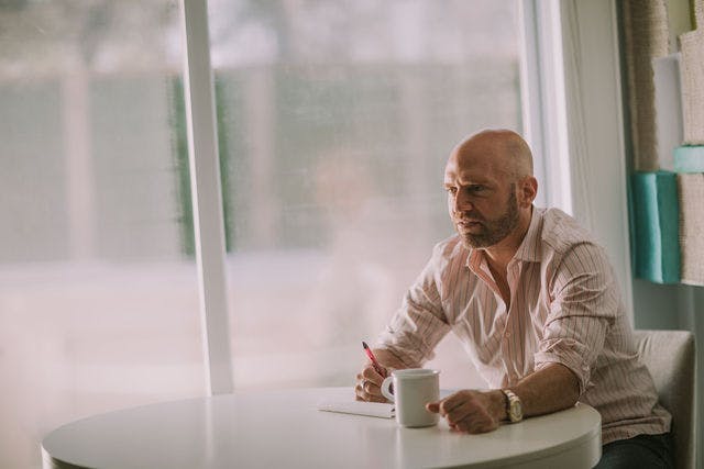 Dating profile photo with coffee, taken by The Match Artist