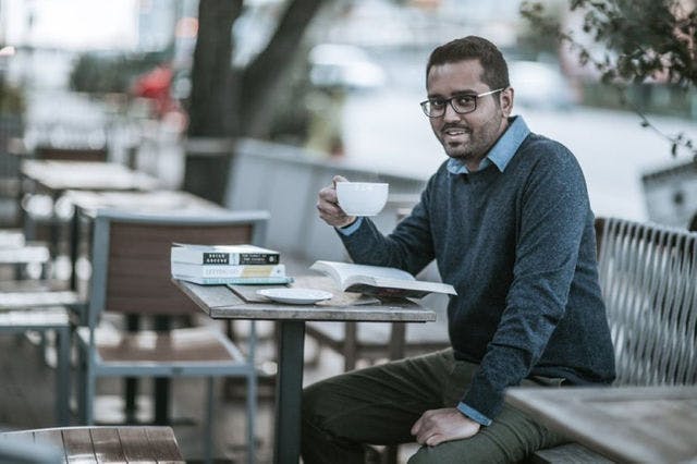 Dating profile photo with coffee, taken by The Match Artist