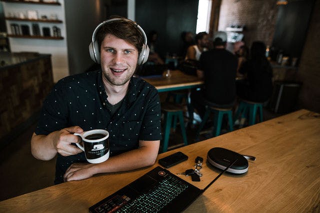 Dating profile photo with coffee, taken by The Match Artist