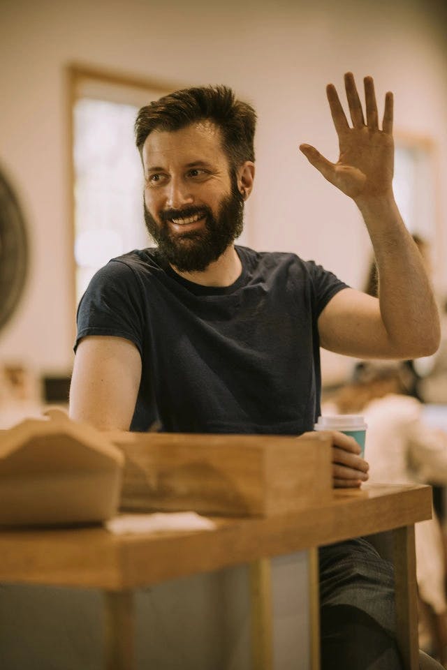 Dating profile photo with coffee, taken by The Match Artist