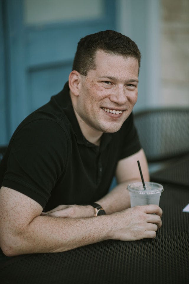 Dating profile photo with coffee, taken by The Match Artist