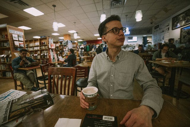 Dating profile photo with coffee, taken by The Match Artist