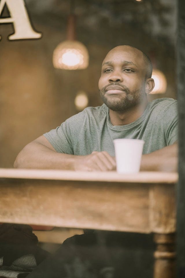 Dating profile photo with coffee, taken by The Match Artist