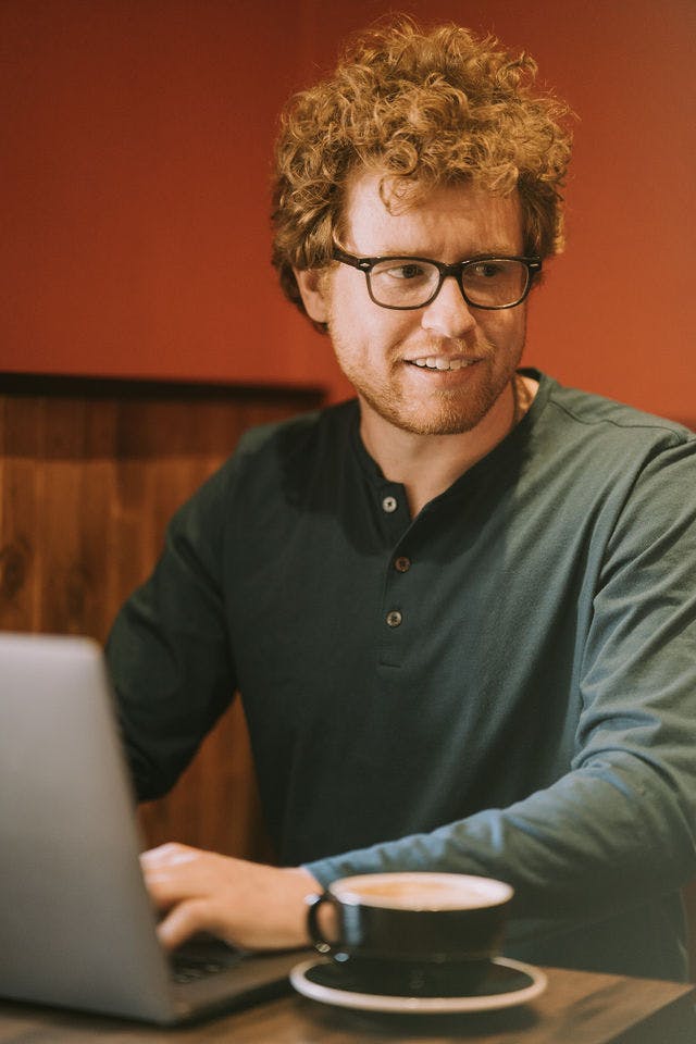 Dating profile photo with coffee, taken by The Match Artist