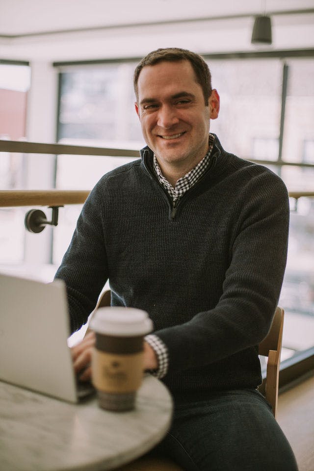 Dating profile photo with coffee, taken by The Match Artist