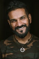 Man holding camera facing forward